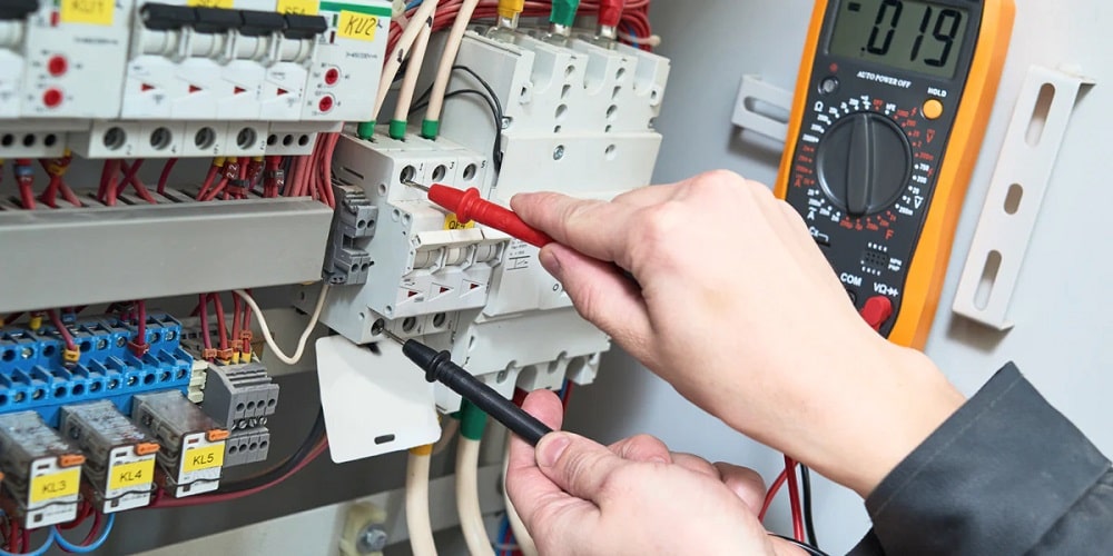 The interior of a commercial-grade fuse box for an industrial air compressor with a blown fuse