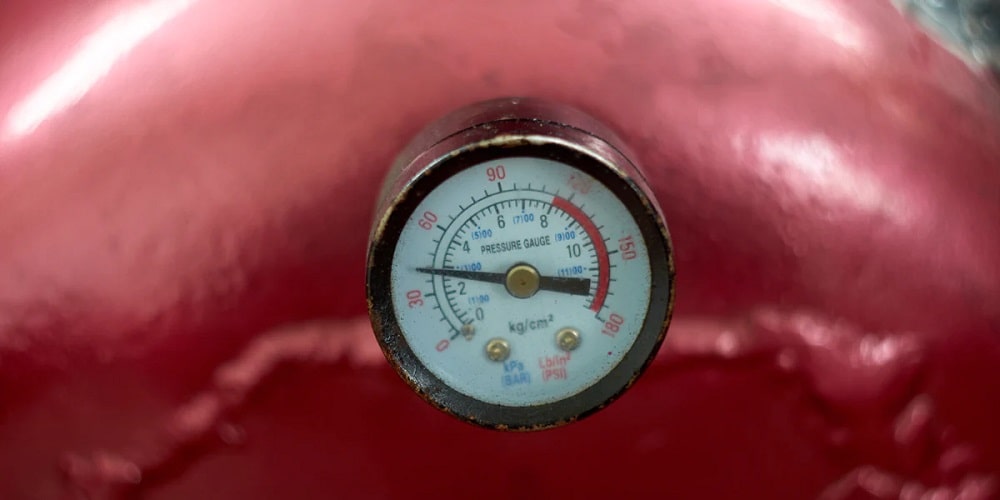 Air compressor pressure gauge showing low pressure (XX PSI)