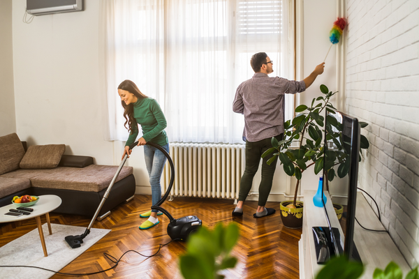 Woman and man cleaning house