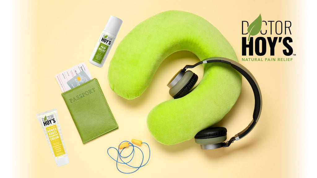 Travel pillow, passport, ear plugs, head phones, and Doctor Hoy’s topicals