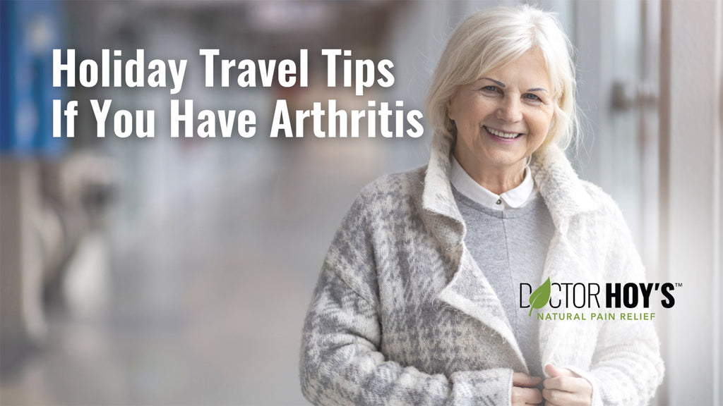 Elderly woman standing in airport smiling