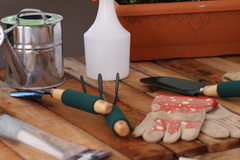 gardening tools and accessories on garden bench