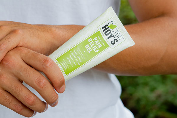 Person holding Doctor Hoy’s natural pain relief gel tube