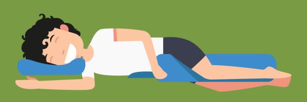 animated man sleeping on side with pillow between legs