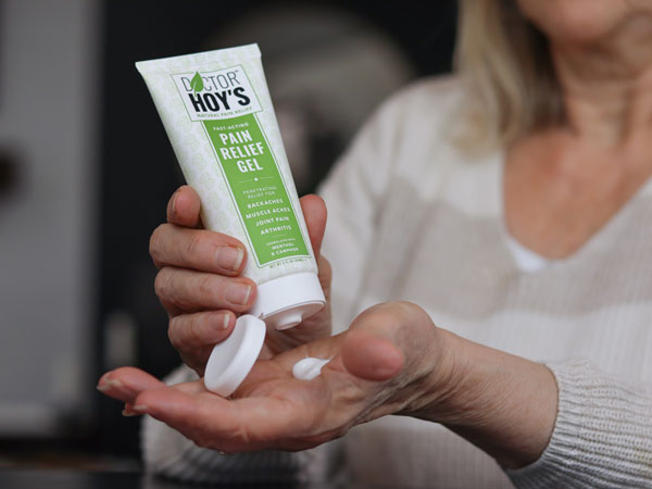 Woman using Doctor Hoy’s Pain Relief Gel for Arthritis on hands