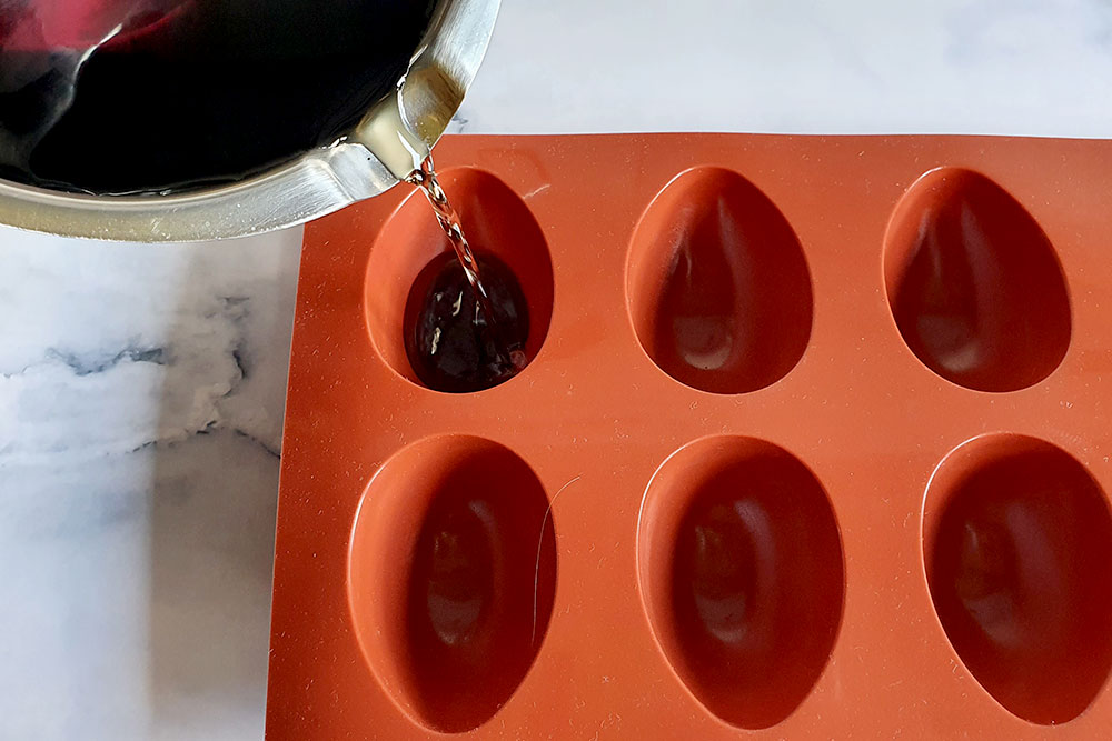 Pouring the wax into the egg mould