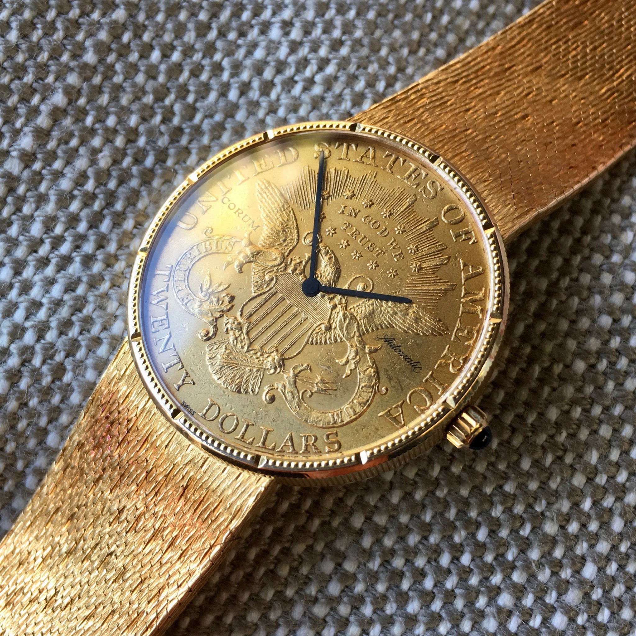 corum coin watch value
