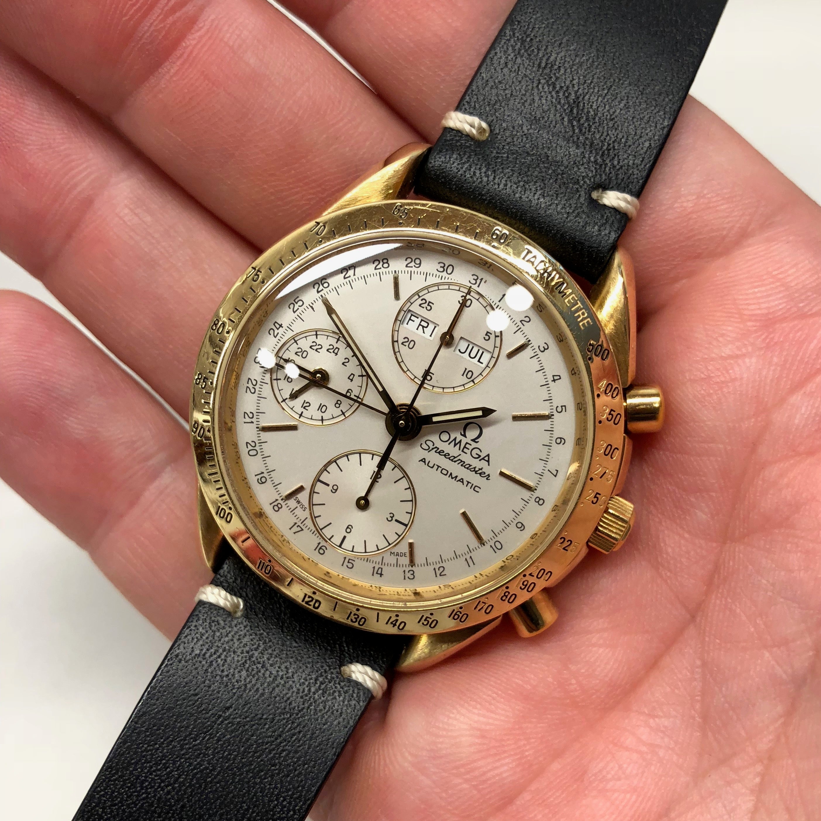 omega speedmaster triple date gold