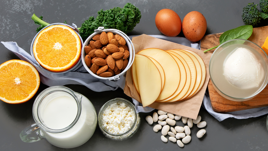 Top view of fruits, vegetables, nuts, legumes, and dairy products