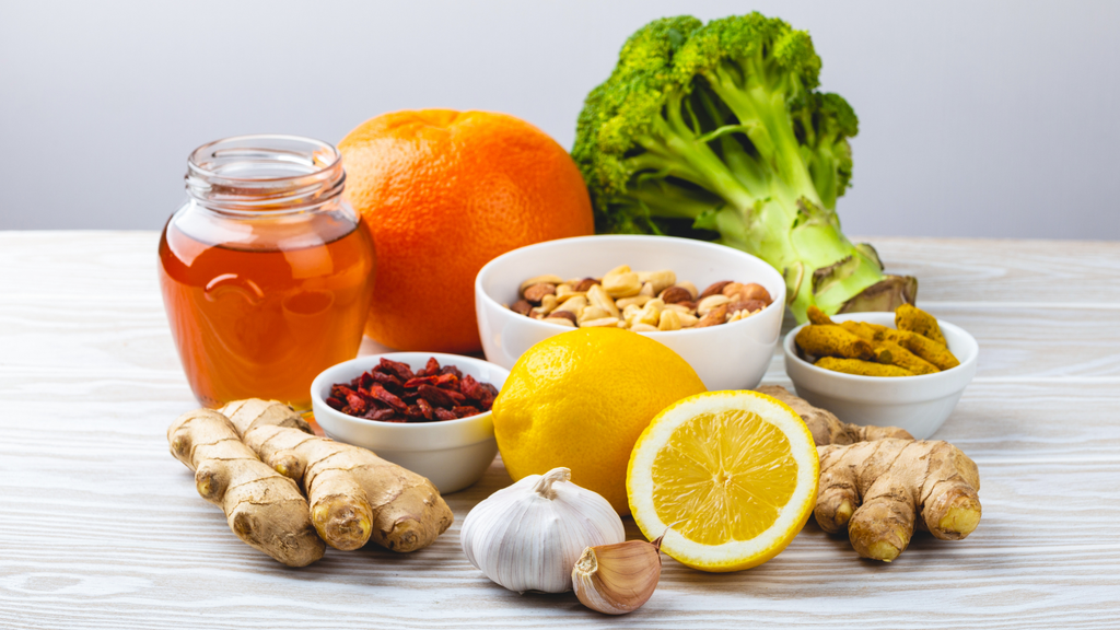 Foods that boost the immune system like lemon, ginger, broccoli, oranges, garlic, honey, and more