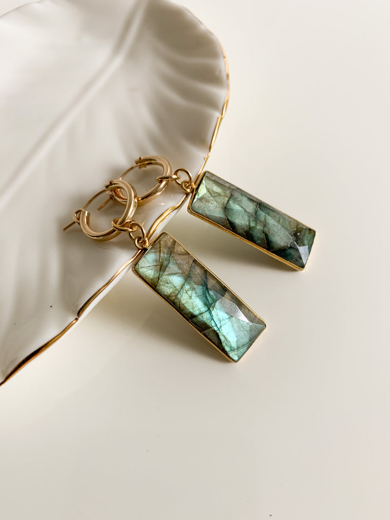 A pair of 14k gold filled hoop earrings with rectangle shaped bezel faceted labradorite gemstone pendant charms.  