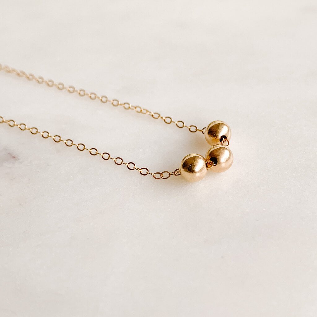 Trio gold ball pendant necklace