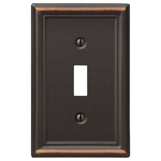 The aged bronze version of the Chelsea collection of Amerelle decorative metal wallplates