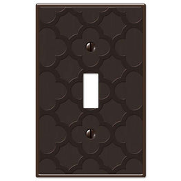 The aged bronze version of the Tangier collection of Amerelle decorative metal wallplates