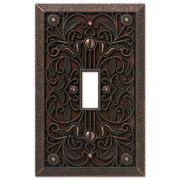 The aged bronze version of the Filigree collection of Amerelle decorative metal wallplates