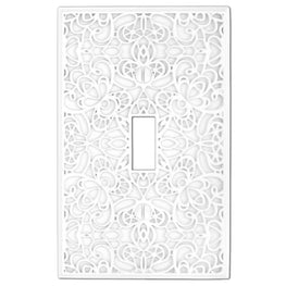 The white version of the Momfort collection of Amerelle decorative metal wallplates