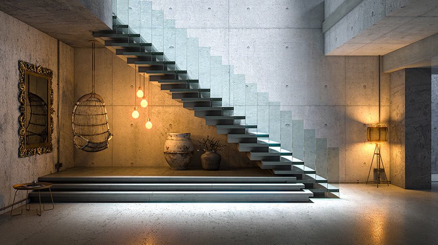 A modern style staircase, a glass wall on the edges of the stairs, cement walls, cement ceiling, cement floor, and lighting fixtures giving off warm light.