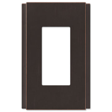 The aged bronze version of the Zen Screwless collection of Amerelle decorative metal wallplates