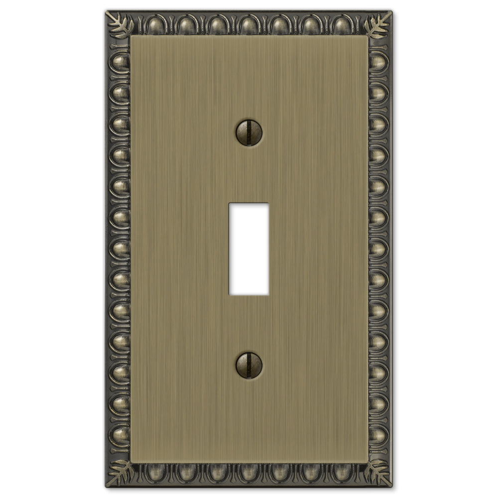 The brushed brass version of the Egg & Dart collection of Amerelle decorative metal wallplates