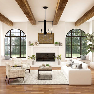 An interior photo of a professionally designed California Casual decor style living room with a neutral color palette, large windows, and a fireplace as the centerpiece of the room