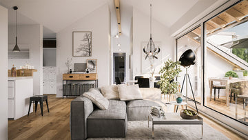 An interior photo of a professionally designed California Casual decor style living room with large amounts of natural light and a neutral color palette