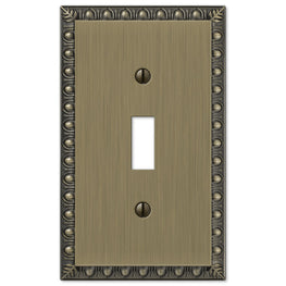 The brushed brass version of the Egg & Dart collection of Amerelle decorative metal wallplates