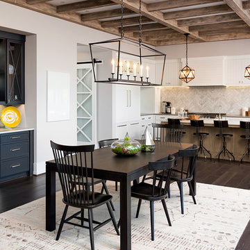 An interior photo of a professionally designed Modern Farmhouse decor style kitchen and dining room with a neutral or beige color palette