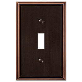 The aged bronze version of the Metro Line collection of Amerelle decorative metal wallplates