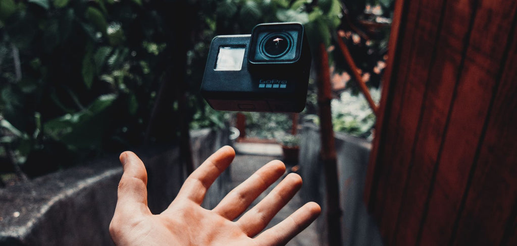 gopro hero 10 being thrown up in hand