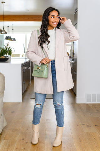 Ivory blazer paired with denim