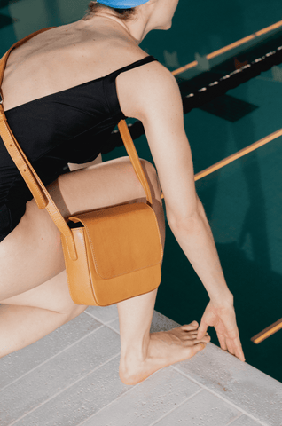 Leather shoulder bag in a swimming pool