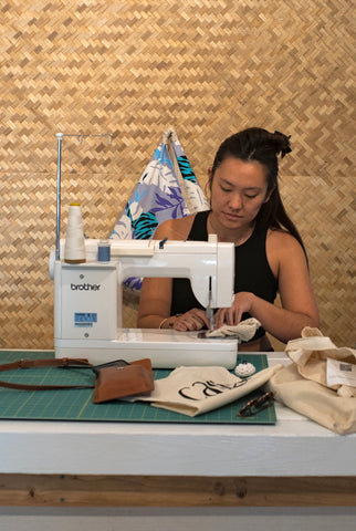 Keely and one of her passions: sewing. Through her hands, she showcases her connection to craftsmanship.