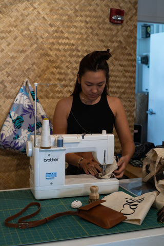 Keely and one of her passions: sewing. Through her hands, she showcases her connection to craftsmanship.