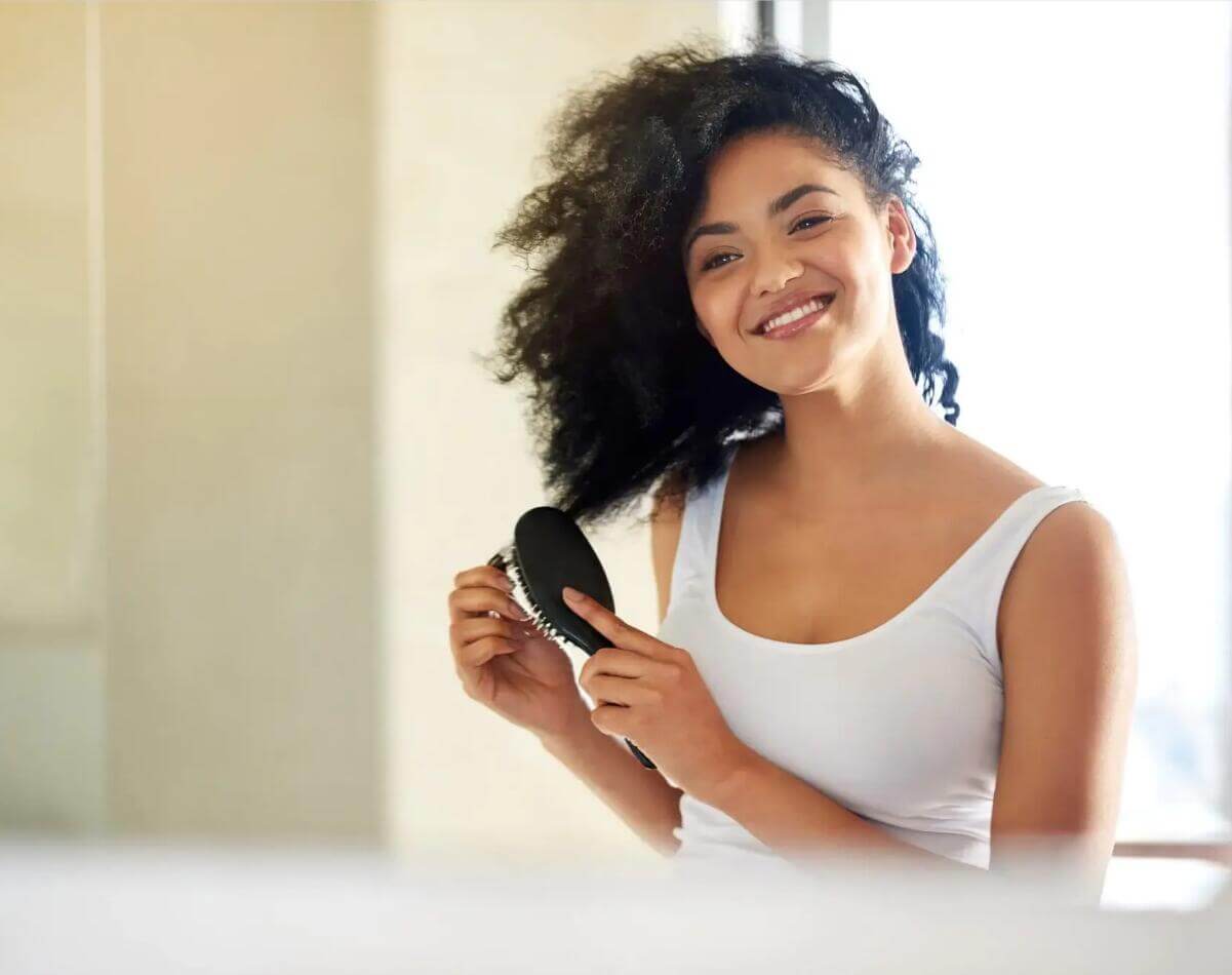 How to Brush Curly Hair Without Disrupting Your Curls