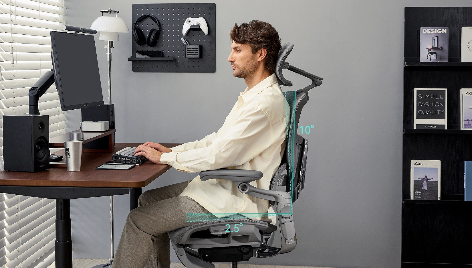 Man sitting at a workstation in the Hinomi H2 Pro ergonomic chair, demonstrating adjustable backrest angles for optimal support.
