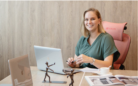 Person sitting on an ergonomic office chair