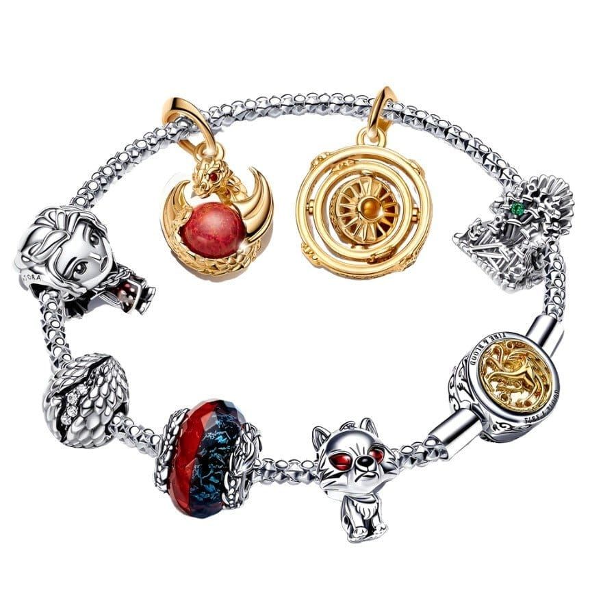 A charm bracelet with multiple personalized charms representing milestones and memories.