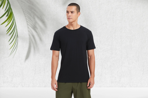 Amend Co.-TM-Male-Model-Upper-Body-Black-Sustainable-T-shirt-Image 26-Landscape with plants.png__PID:b6b8de28-8a83-4237-a0d1-5730ae94c4e6