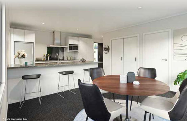 Kitchen with white countertop and cabinets with wood top round dining table