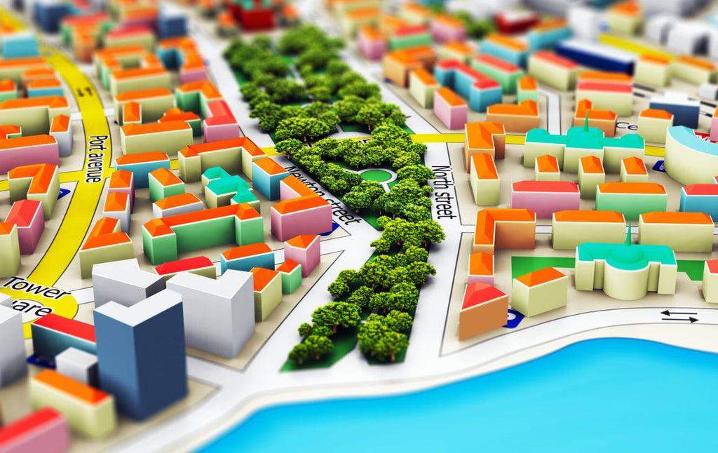 Scaled city model with orange, green, blue and yellow colors and showing map and parks