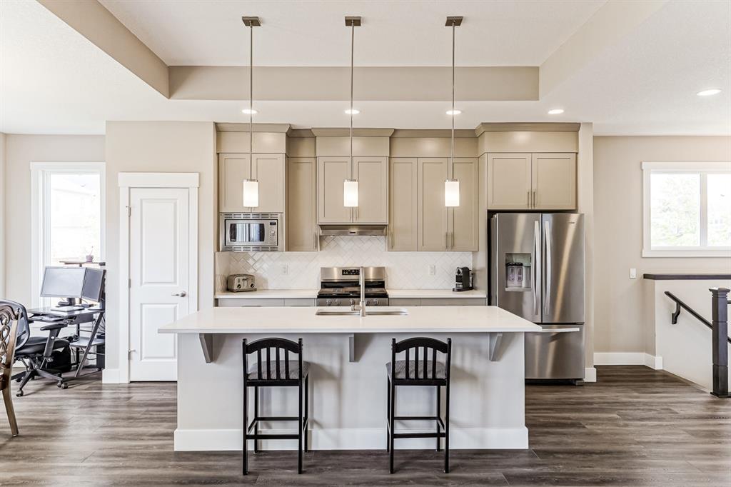 kitchen interior design white and brown theme with shaker cabinet door type luxury vinyl planks and painted white walls and ceiling