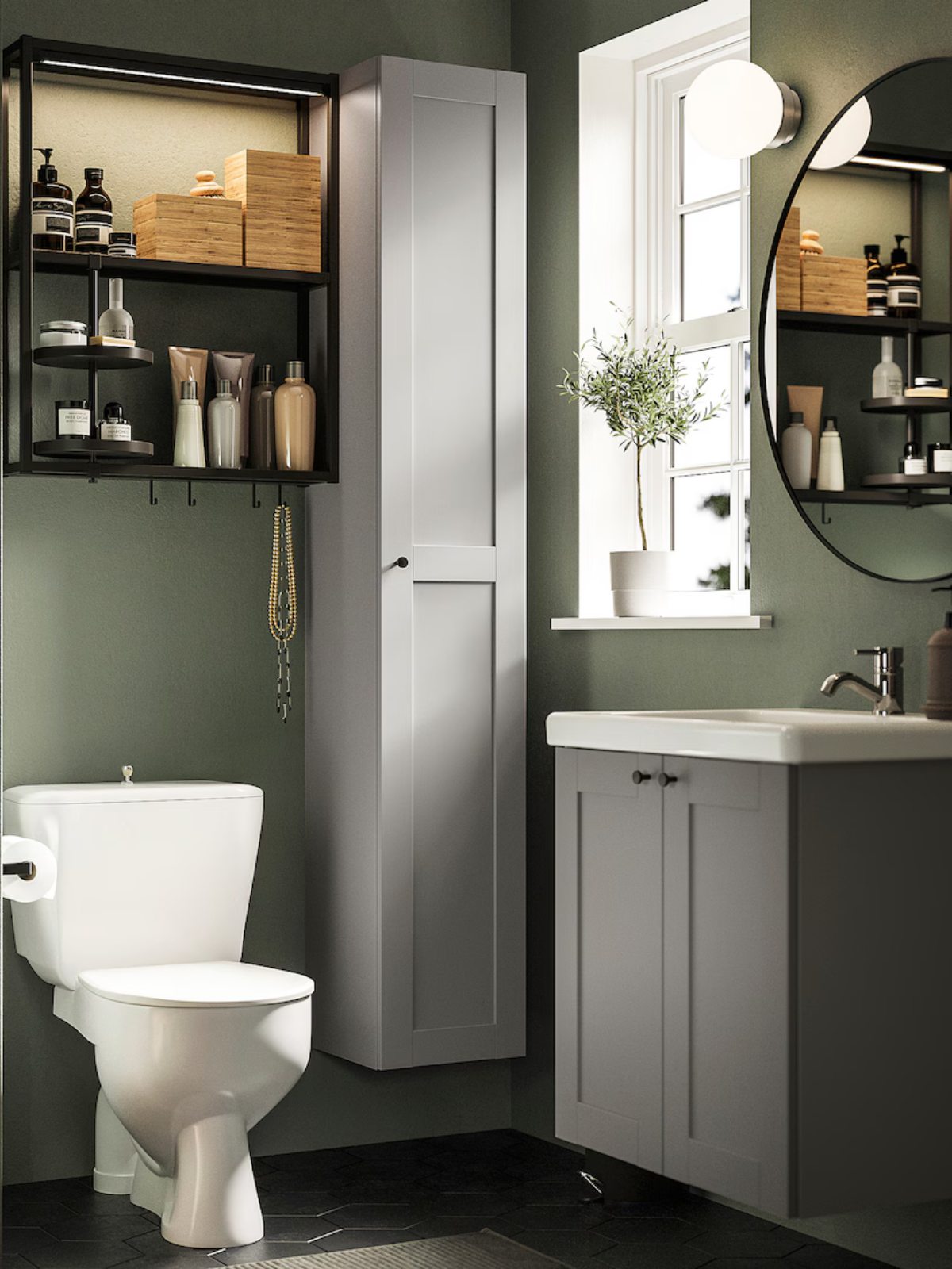 powder room with toilet, floor tiles, green painted walls, storage cabinet and window