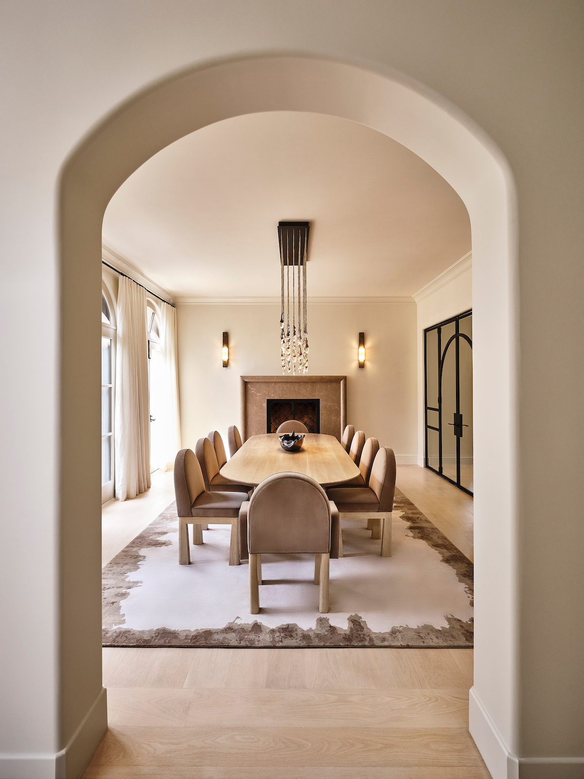 dining area interior design showing monochrome walls, archway, dining chair and table by design milk