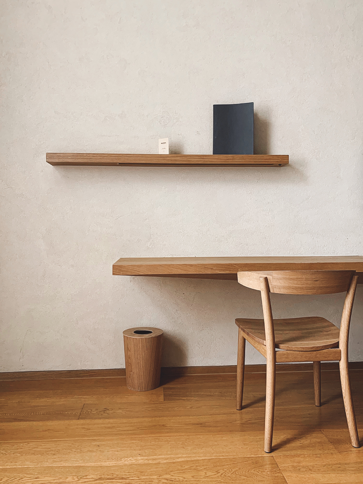 a blank study space with wooden table and chair