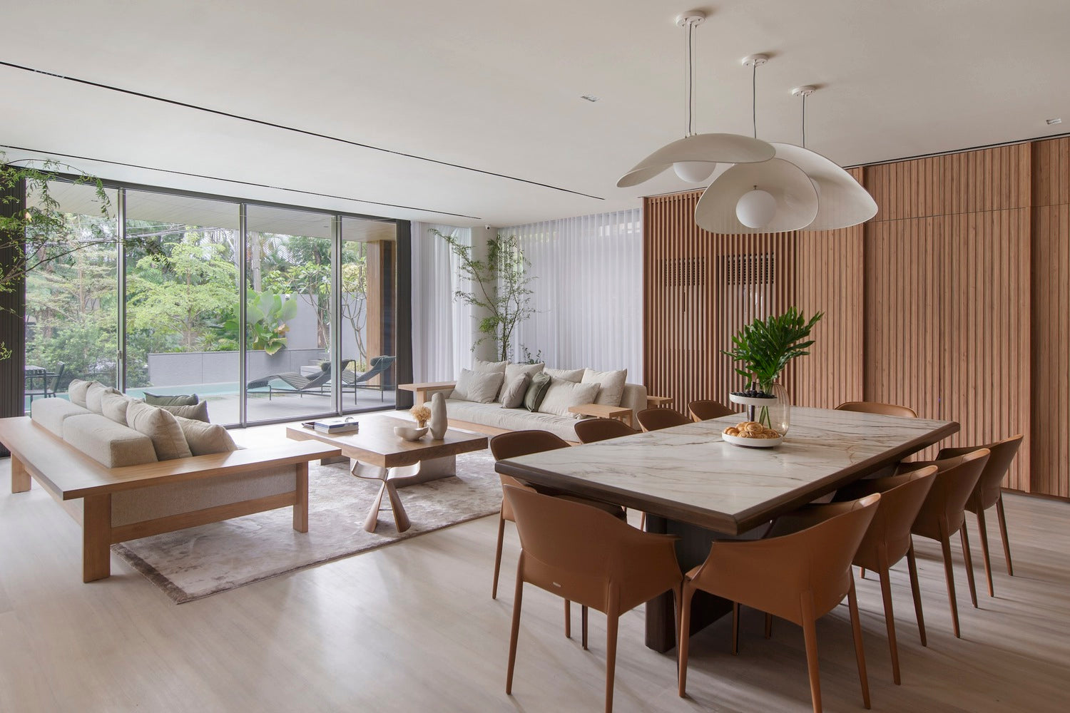 an open layout of dining and living room showing wooden finishes