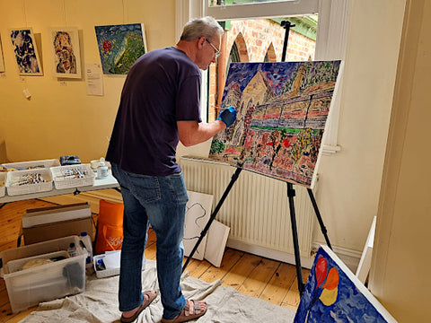 Ade Blakey completing a painting while artist in residence at The Convent Daylesford