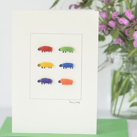 Greetings card featuring 6 hand finished sheep in bright colours