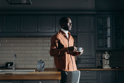 Man holding cup of tea