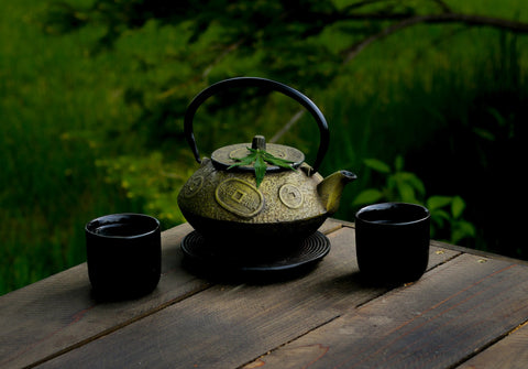 selective focus photography of gray teapot