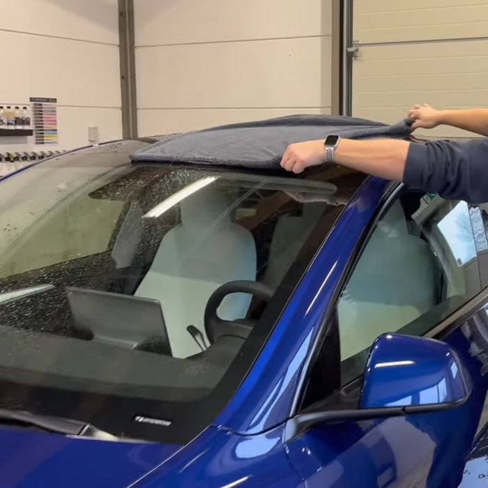 Drying Tesla Model Y with Microfibre Towel